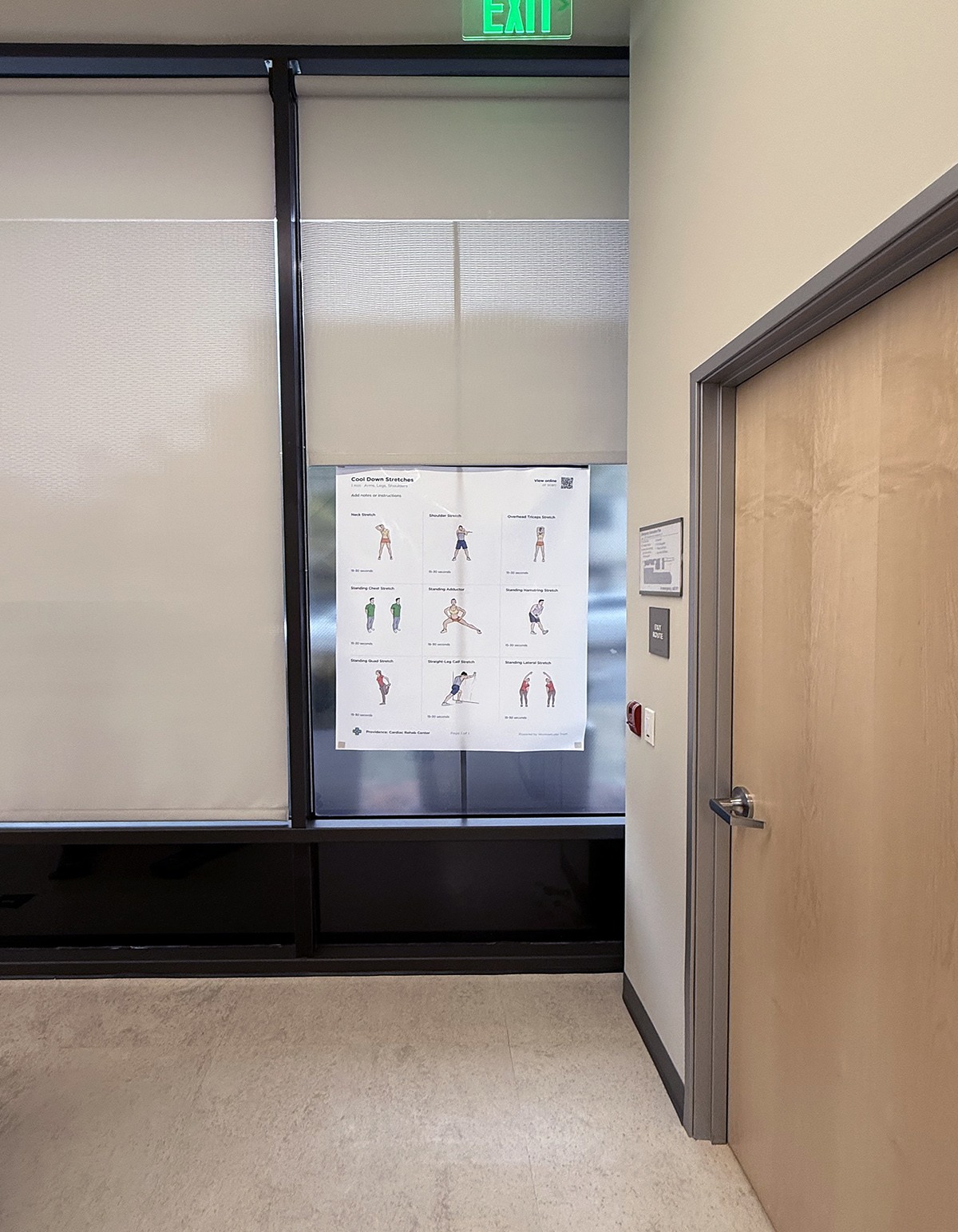 A large Cool Down Stretches poster created in Train is displayed at Providence Saint John’s